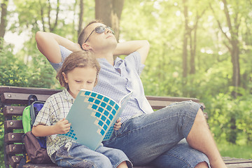 Image showing Father and son playing at the park at the day time.