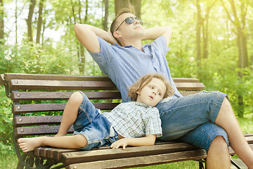 Image showing Father and son playing at the park at the day time.