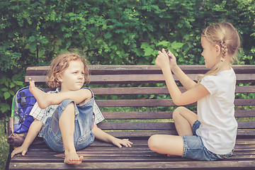 Image showing Three happy children  playing in park