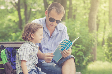 Image showing Father and son playing at the park at the day time.