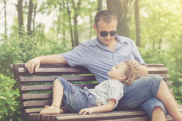 Image showing Father and son playing at the park at the day time.