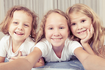 Image showing Portrait of happy children which are lying on the floor in the h