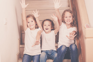 Image showing Portrait of happy children which are sitting on the stairs in th