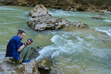 Image showing Photographing a mountain river