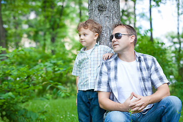 Image showing Father and son playing in the park at the day time.