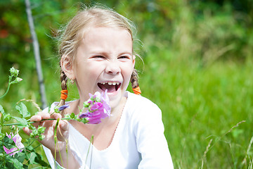 Image showing portrait of a beautiful young girl with wildflowers 