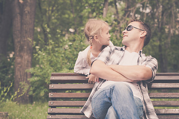 Image showing Father and daughter playing at the park at the day time.