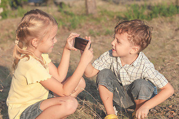 Image showing Two happy children  playing in park