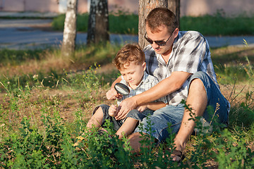 Image showing Father and son playing at the park at the day time.