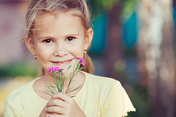 Image showing portrait of a beautiful young girl with wildflowers