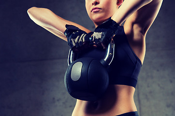 Image showing close up of woman with kettlebell in gym