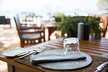 Image showing served table at open-air restaurant on beach