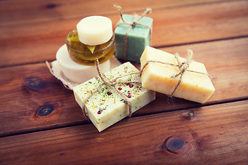 Image showing close up of handmade soap bars on wood