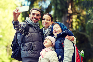 Image showing family taking selfie with smartphone in woods