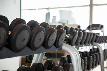 Image showing dumbbells and sports equipment in gym