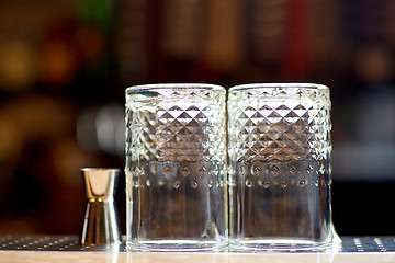 Image showing two vintage glasses and jigger on bar counter