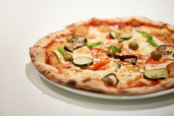 Image showing close up of pizza on plate at pizzeria