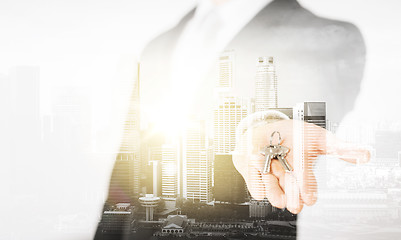 Image showing close up of businessman holding keys