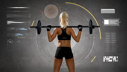 Image showing sporty young woman flexing muscles with barbell