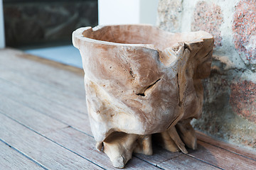 Image showing outdoor wooden bowl or vase on terrace floor