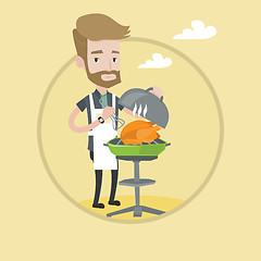 Image showing Man cooking chicken on barbecue grill.