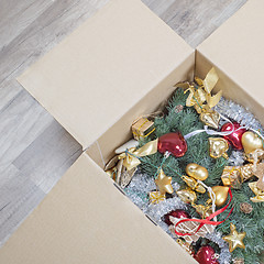 Image showing christmas tree, glitter baubles and tinsel in the box