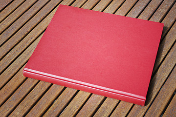 Image showing Red book on the outdoor table at coffee shop