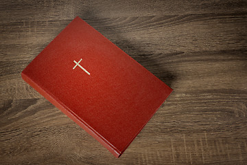 Image showing Red bible with cross on cover