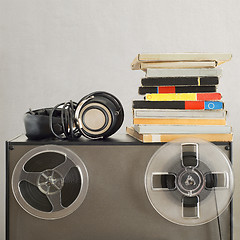 Image showing Vintage magnetic audio reels and headphones on the analog tape recorder