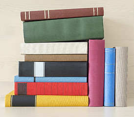 Image showing stack of books in the bookself