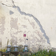 Image showing abandoned cracked stucco wall with ventilation grille