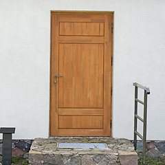 Image showing stucco wall with brown door