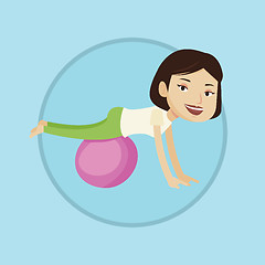 Image showing Young woman exercising with fitball.