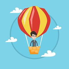 Image showing Man flying in hot air balloon vector illustration.