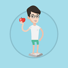 Image showing Man standing on scale and holding apple in hand.