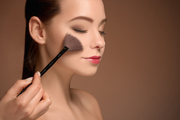 Image showing Beauty Girl with Makeup Brush. Perfect Skin. Applying Makeup