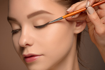 Image showing Beautiful female eyes with make-up and brush