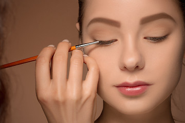 Image showing Beautiful female eyes with make-up and brush