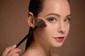 Image showing Beauty Girl with Makeup Brush. Perfect Skin. Applying Makeup