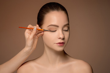 Image showing Beautiful female eyes with make-up and brush