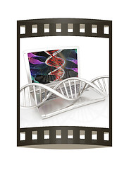 Image showing Laptop with dna medical model background on laptop screen. 3d il