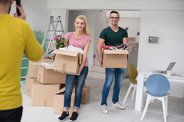 Image showing young couple moving into a new home