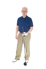 Image showing Senior man standing with golf iron.