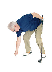 Image showing Senior man pleasing his golf ball.