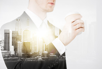 Image showing close up of businessman drinking take away coffee