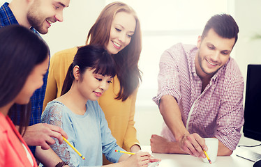 Image showing happy creative team or students working at office