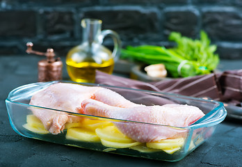 Image showing raw chicken legs and potato 