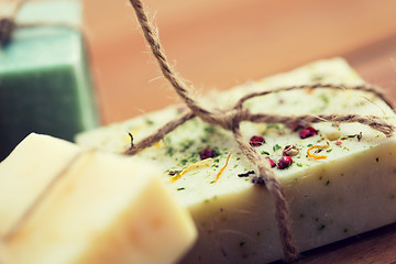 Image showing close up of handmade soap bars on wood