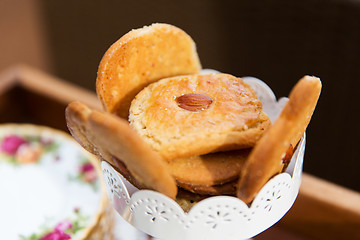 Image showing close up of almond cookies in vase