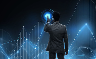 Image showing businessman working with virtual chart projection